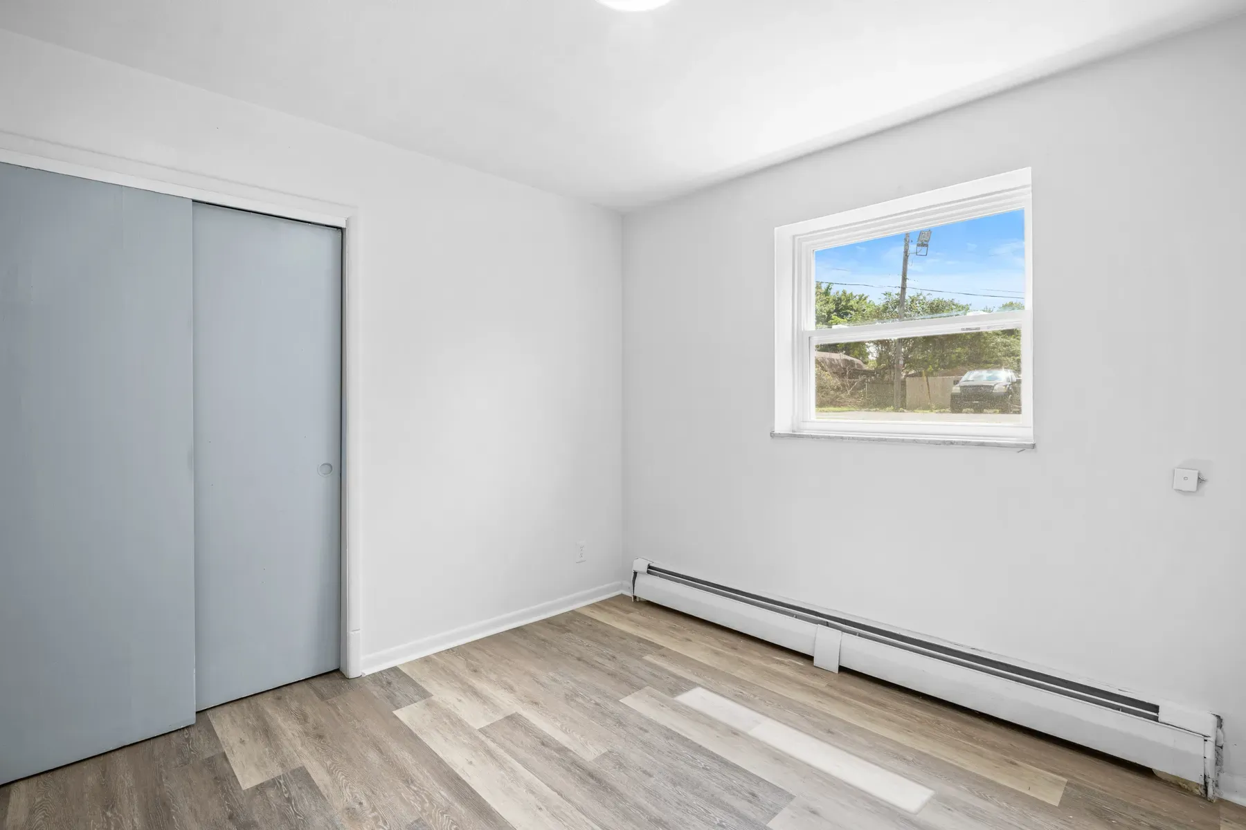 Bedroom with two windows and fresh neutral paint