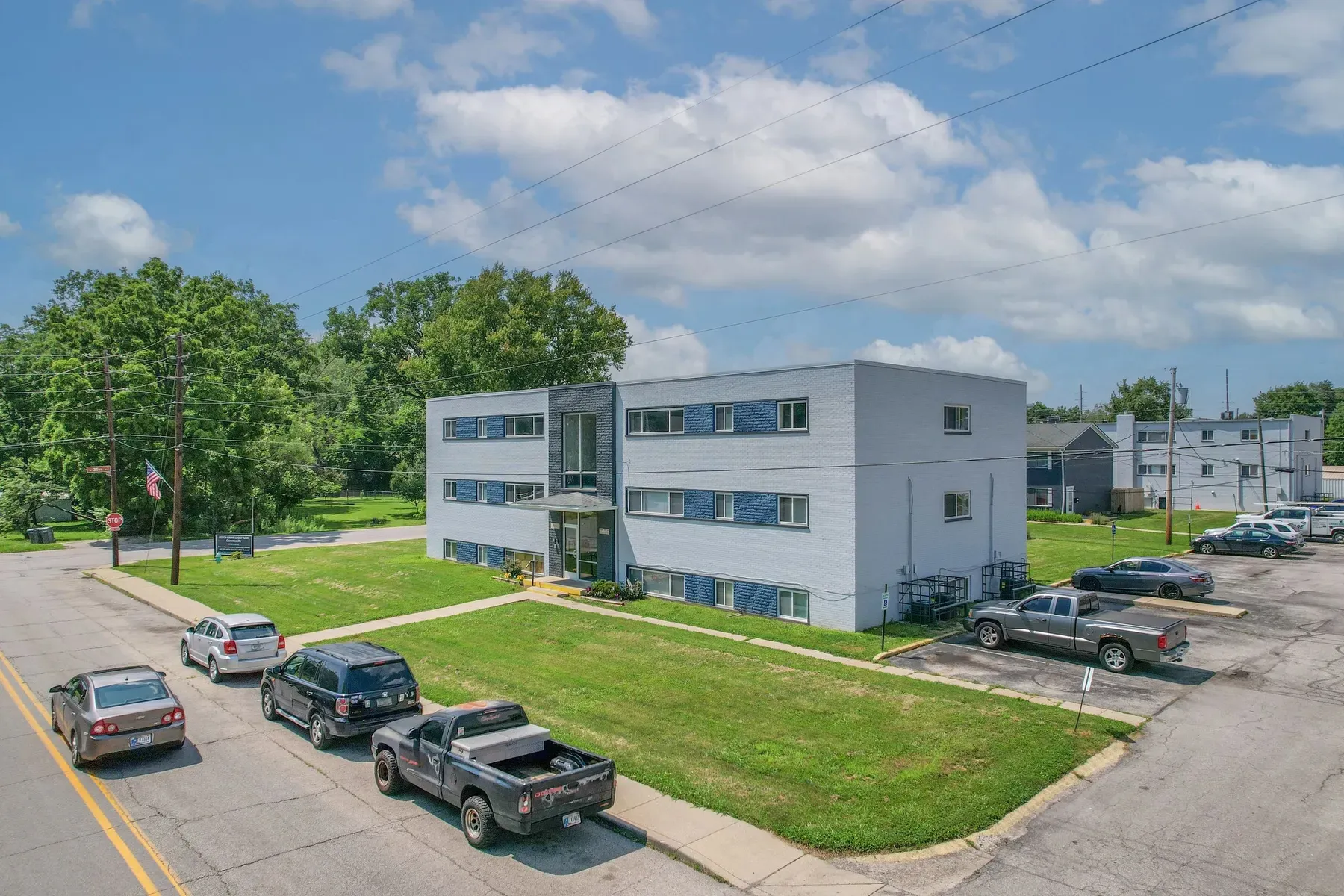Aerial view of the apartment building and parking area
