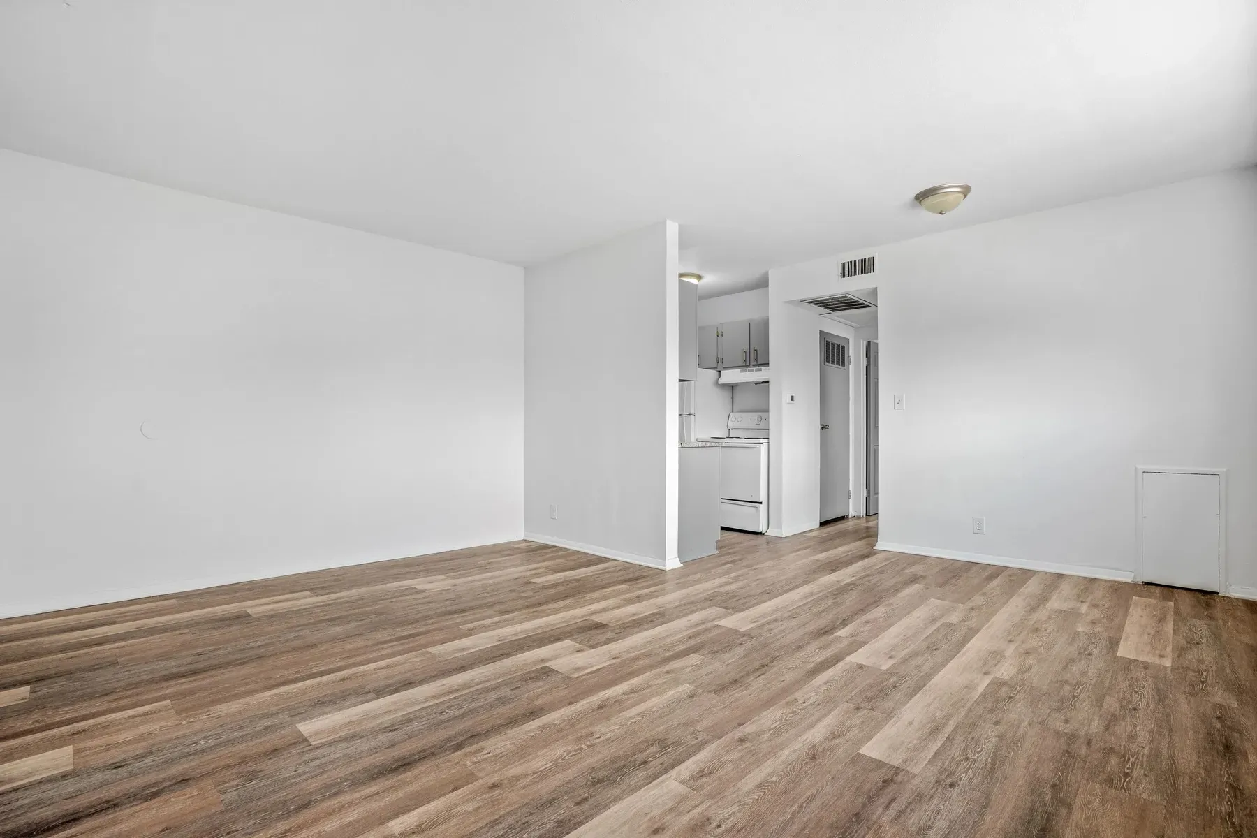 Apartment interior looking toward the kitchen and hallway