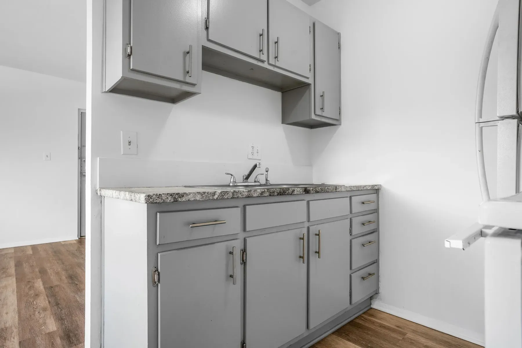 Kitchen with gray cabinets and a double-basin sink