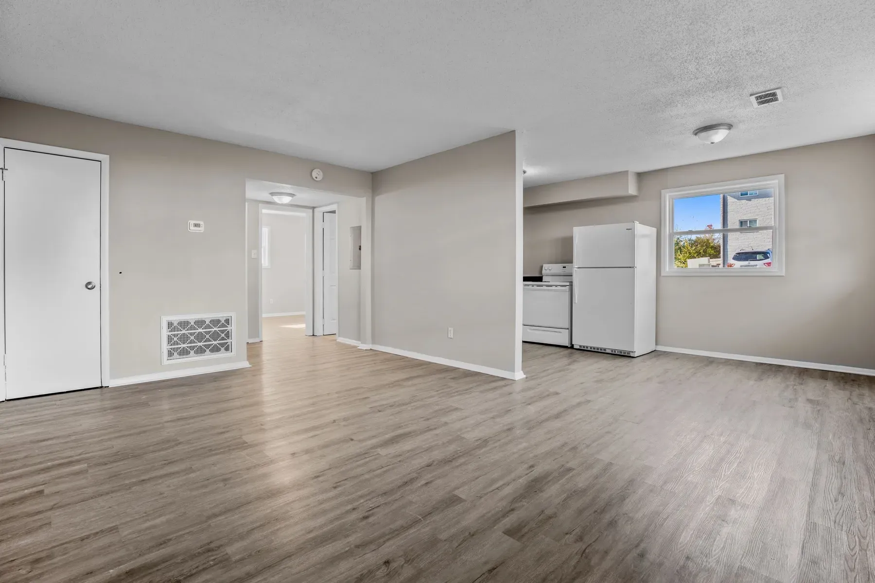 Apartment interior with a kitchen and wood-look flooring
